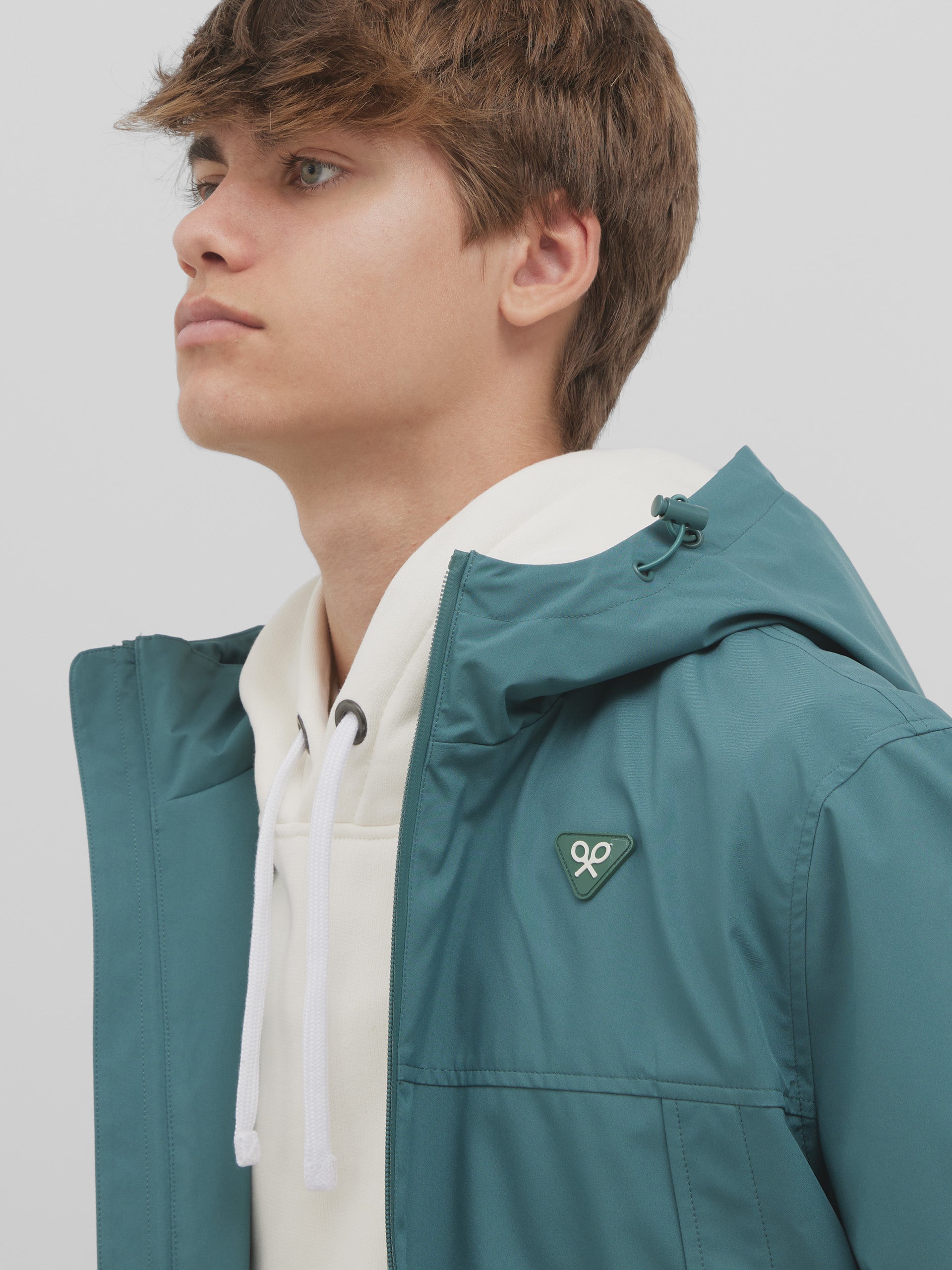 Green hooded windbreaker jacket