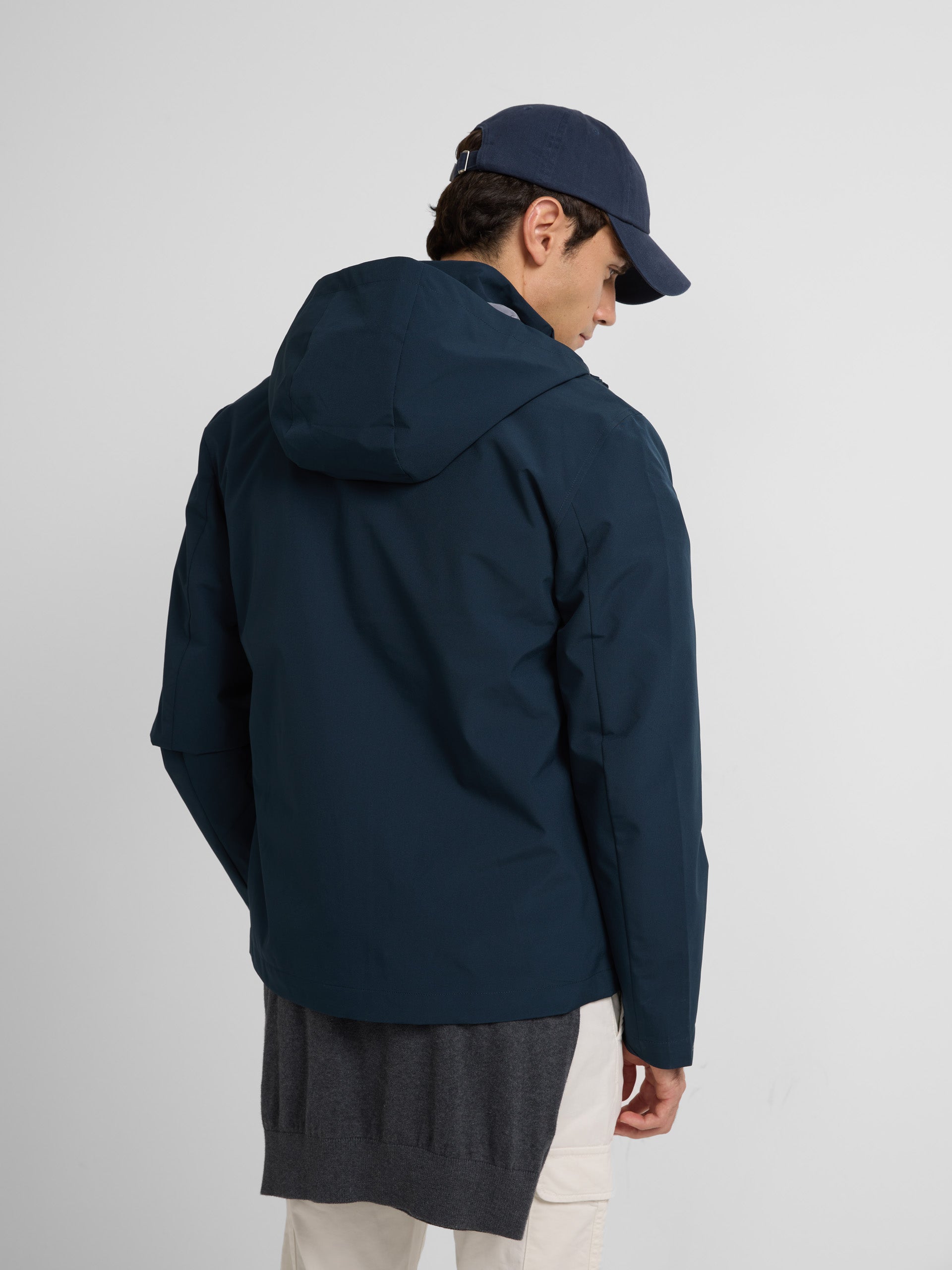 Navy blue hooded windbreaker jacket