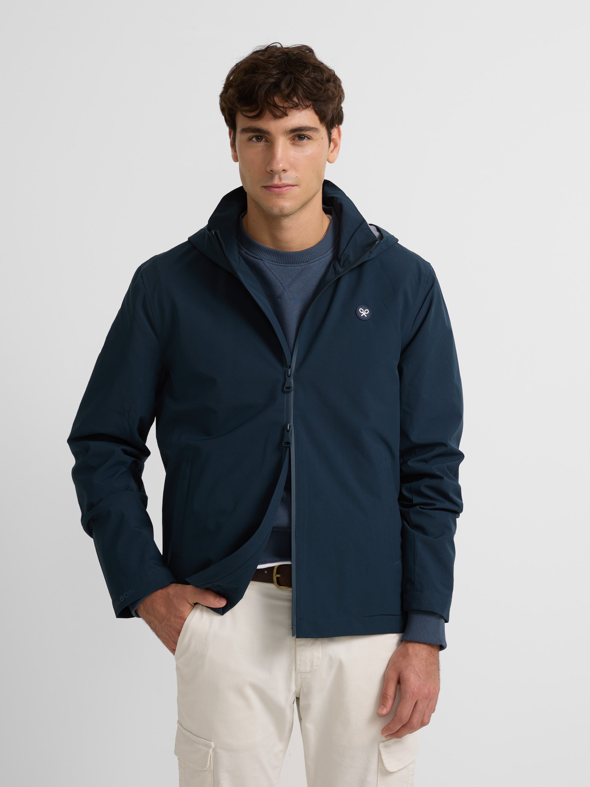 Navy blue hooded windbreaker jacket