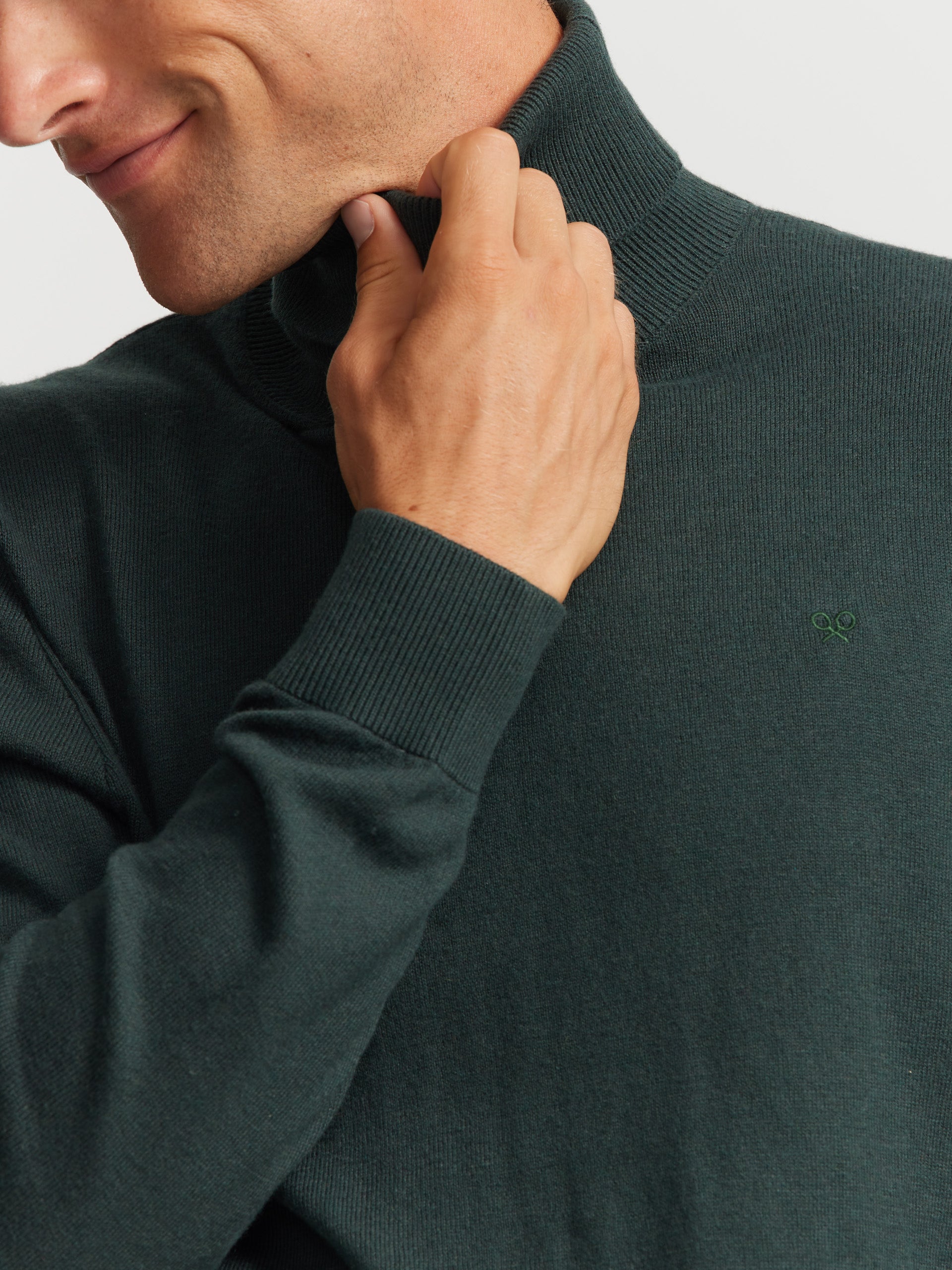 Plain dark green turtleneck sweater