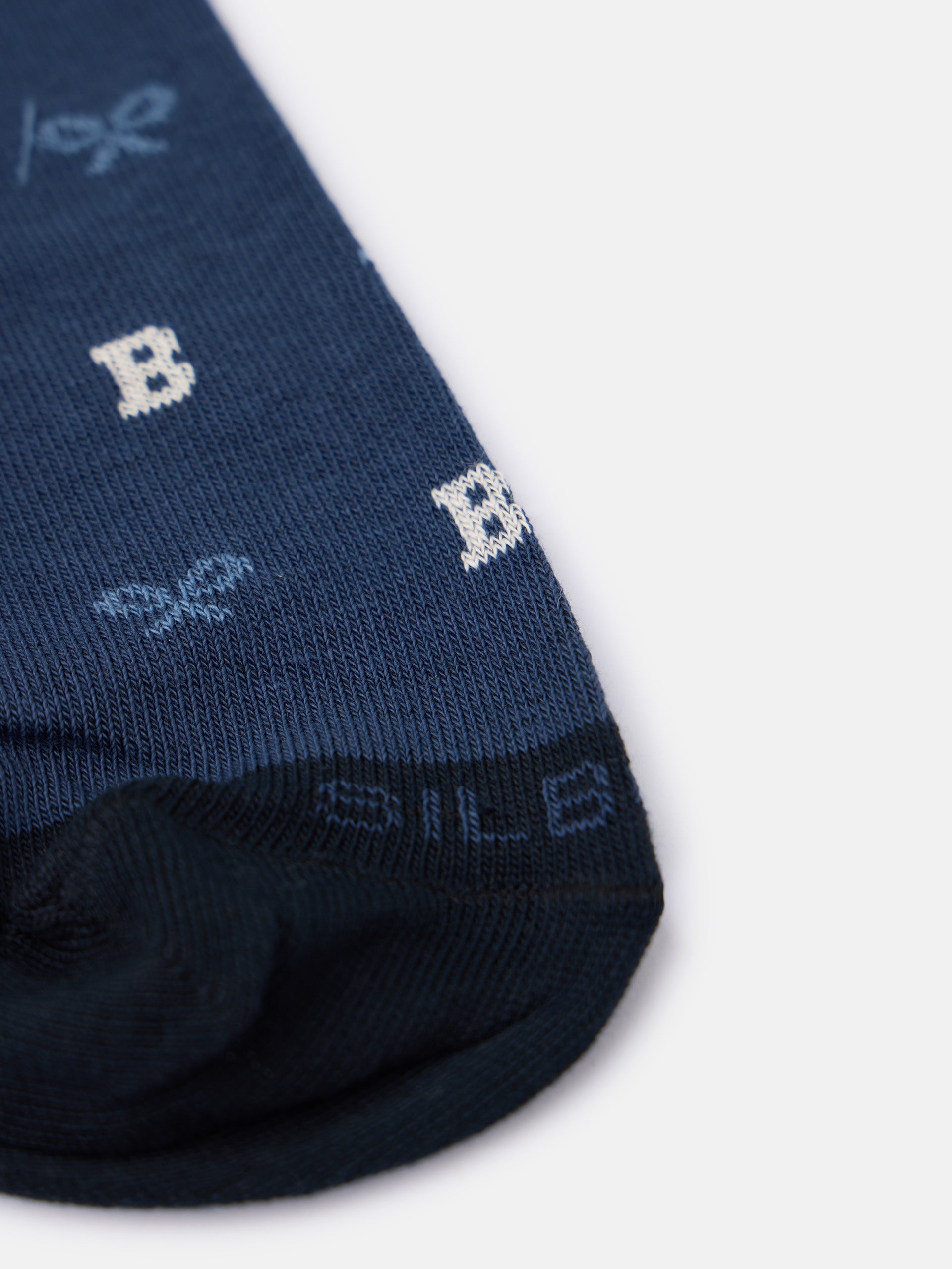 Whistling sock with blue letter motifs