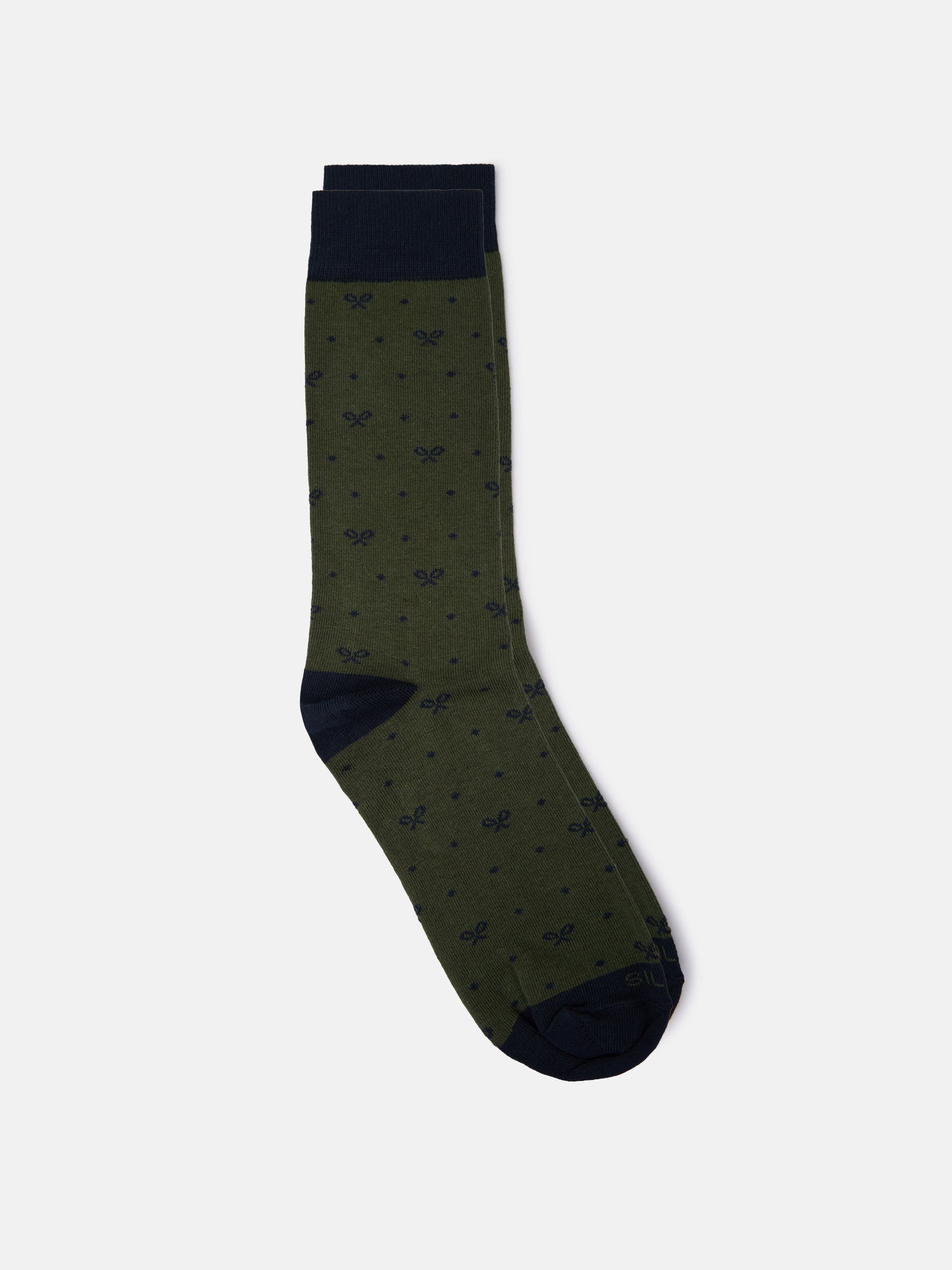 Whistling sock with green polka dot motifs