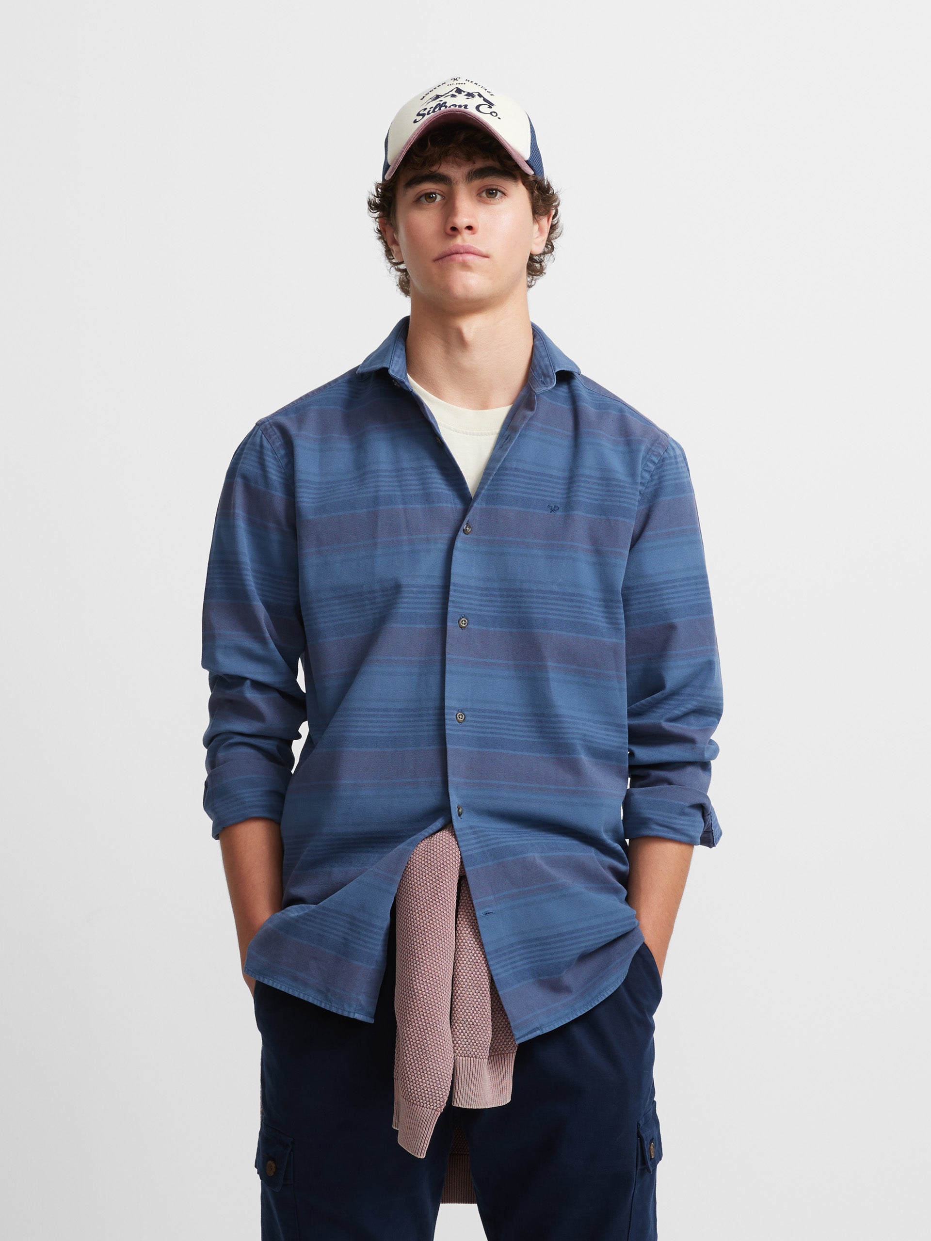 Sport shirt with horizontal stripes and blue jeans