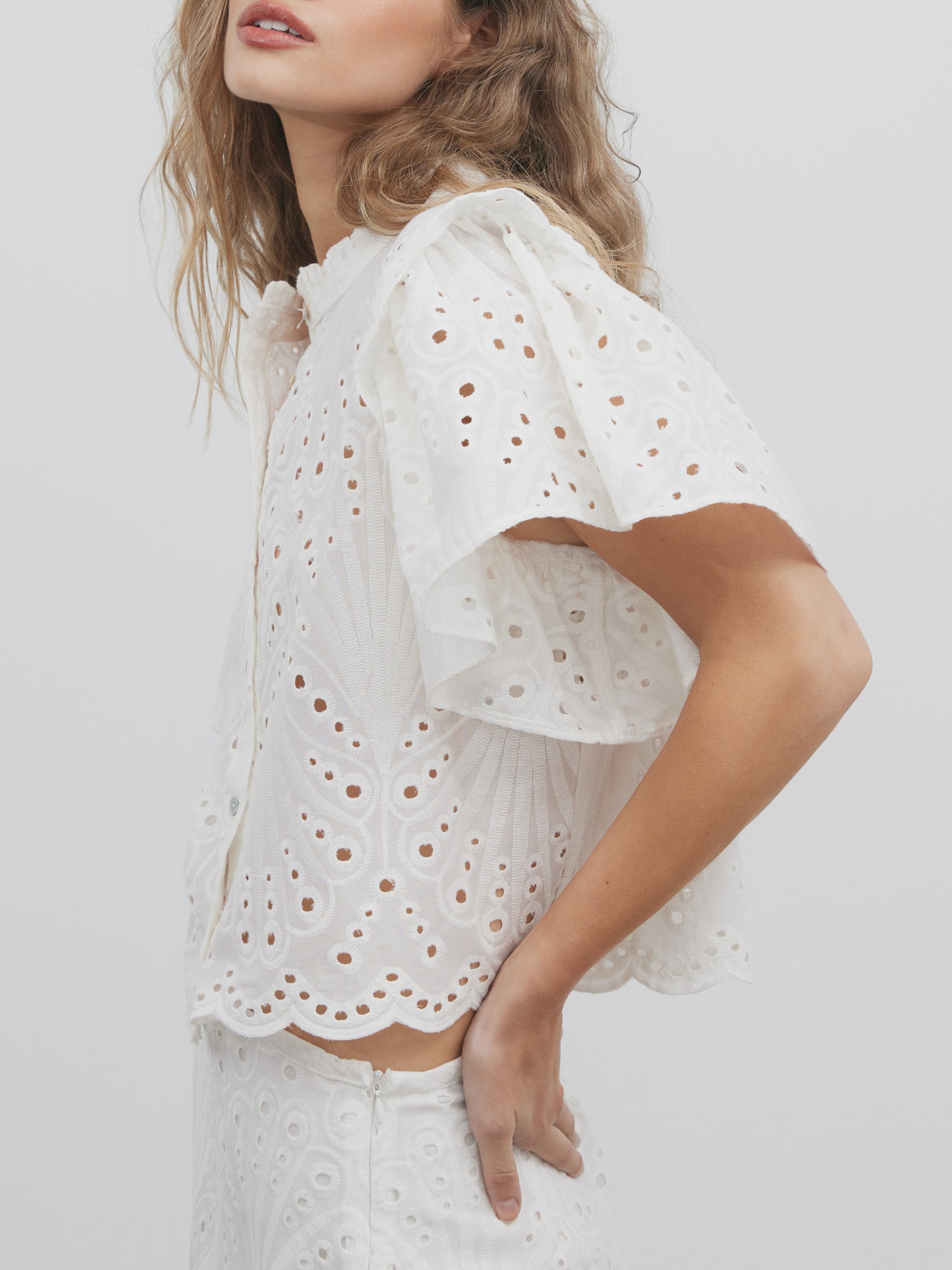 White embroidered ruffle blouse