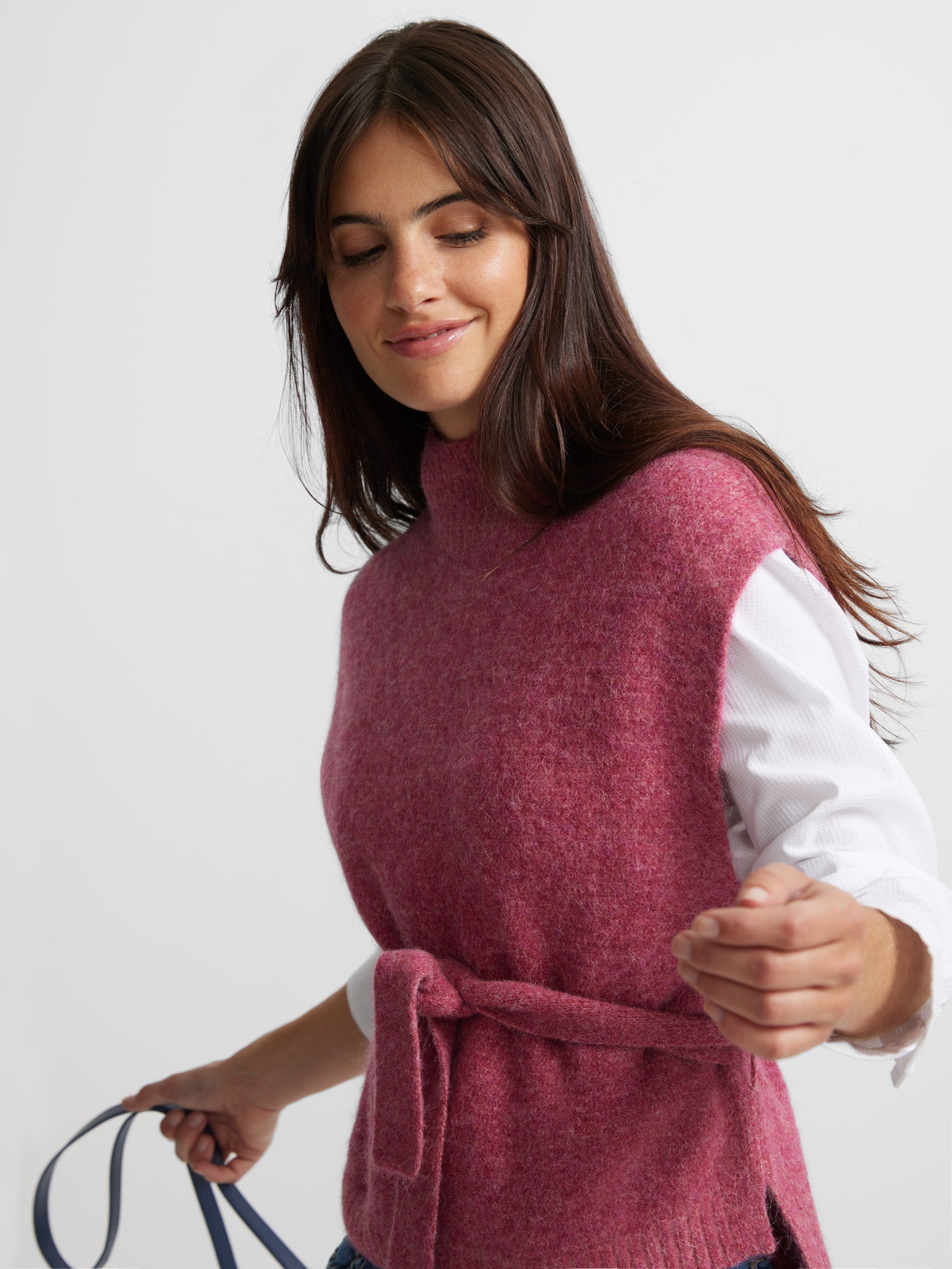 Poncho tricoté rose