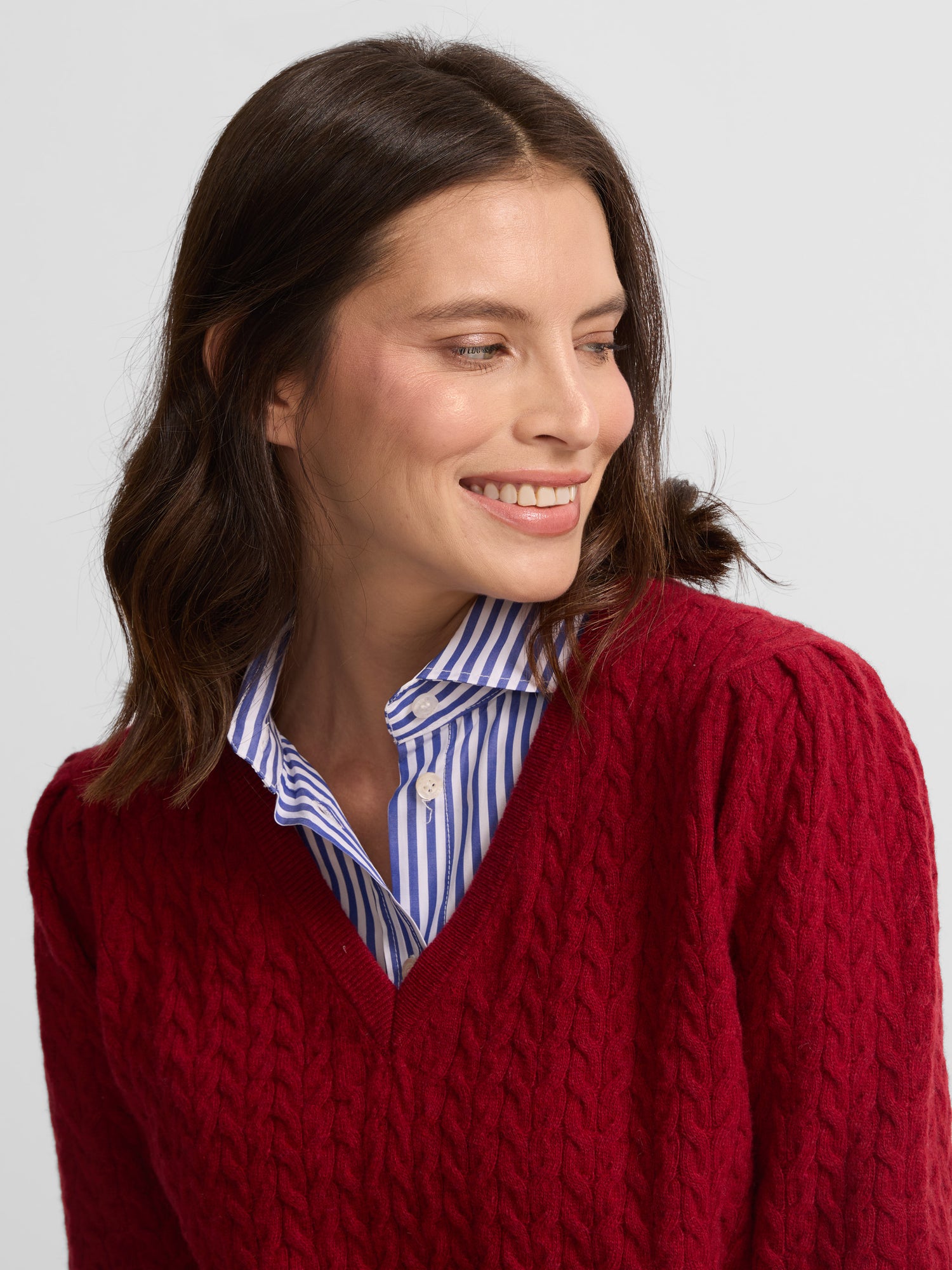 Red V-neck cable knit sweater