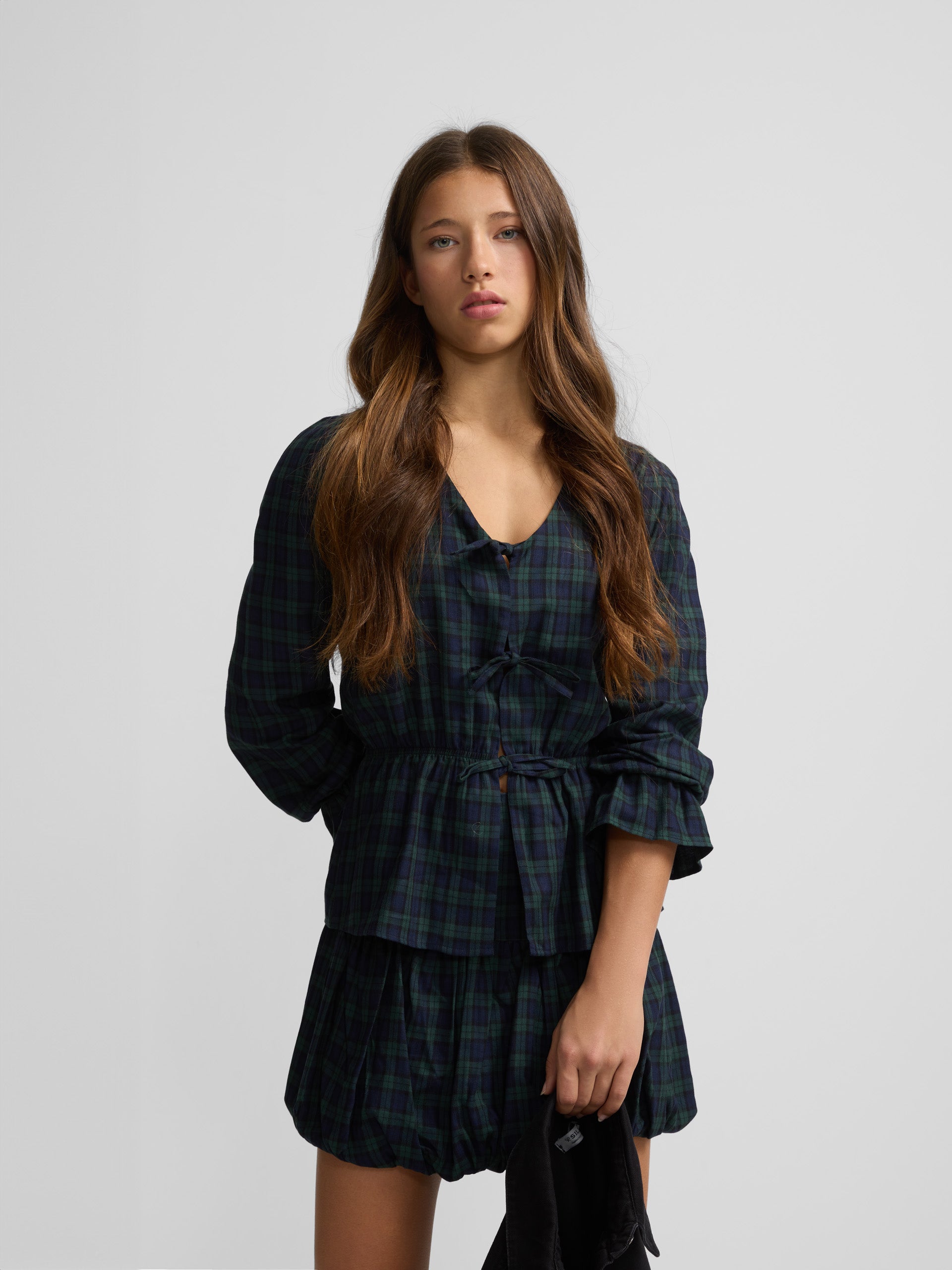 Navy and green checked blouse with bows