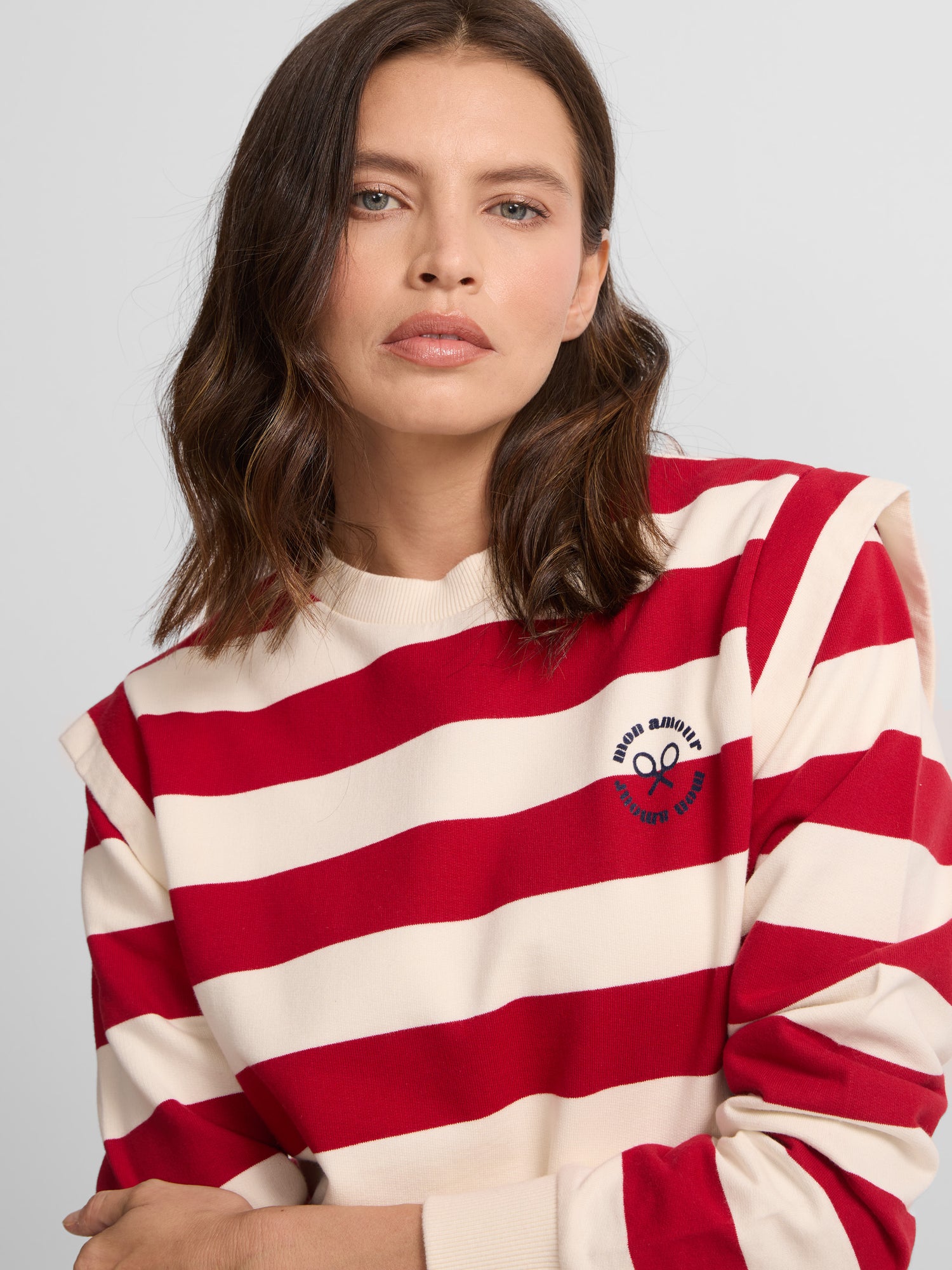 Woman sweatshirt with red striped shoulder pads