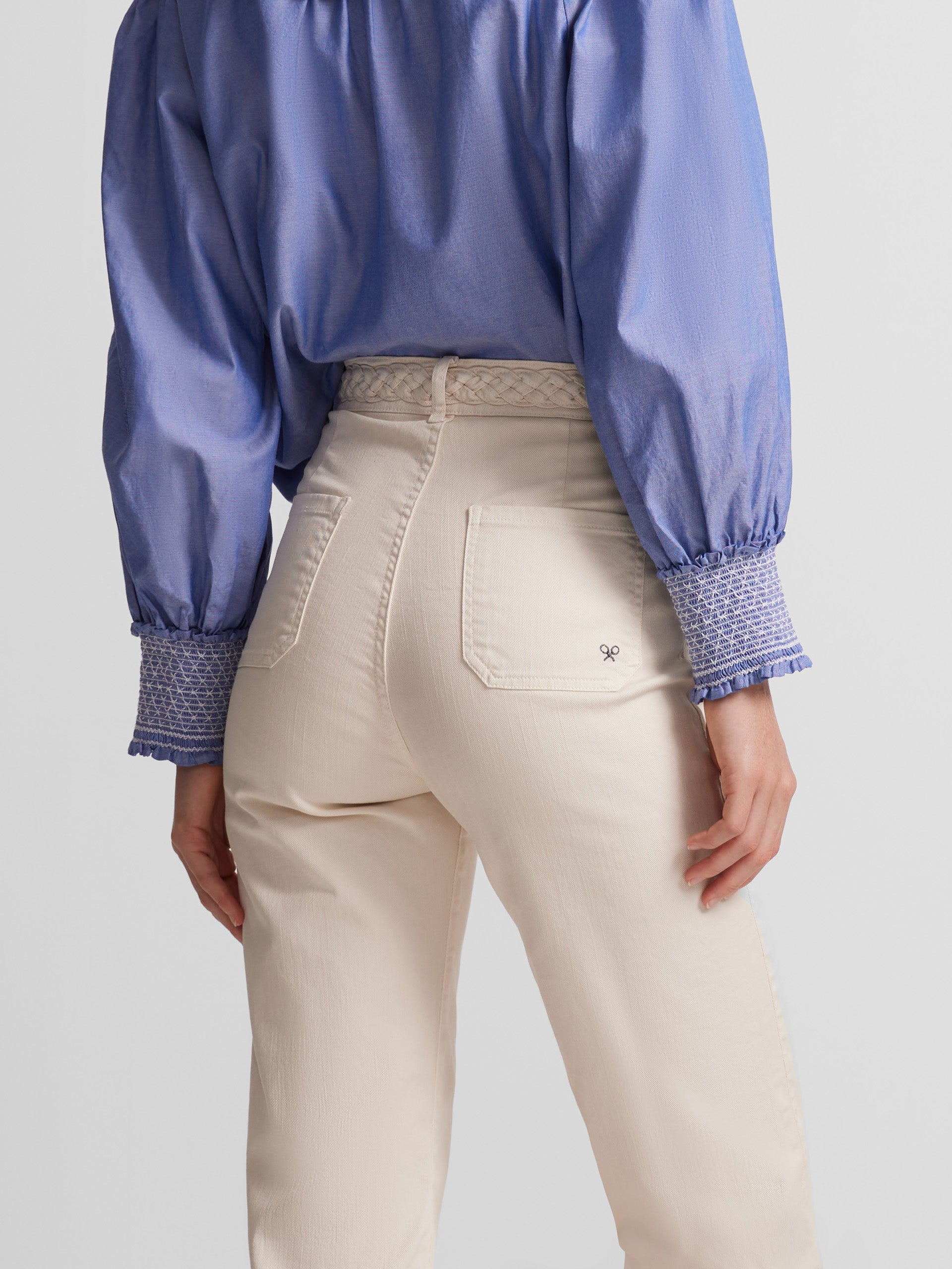 Pantalon flare detalle trenza crudo