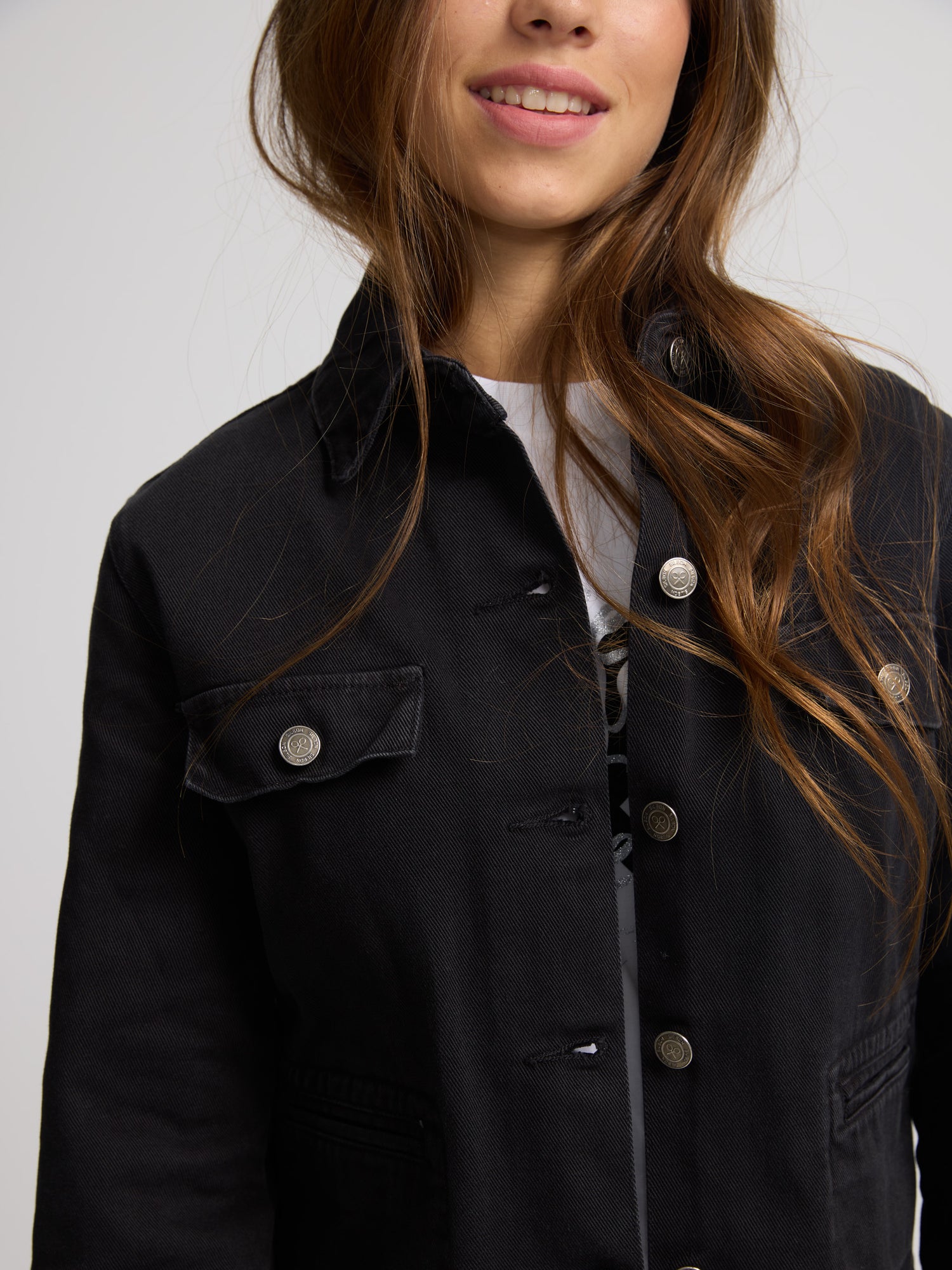 Black button denim jacket