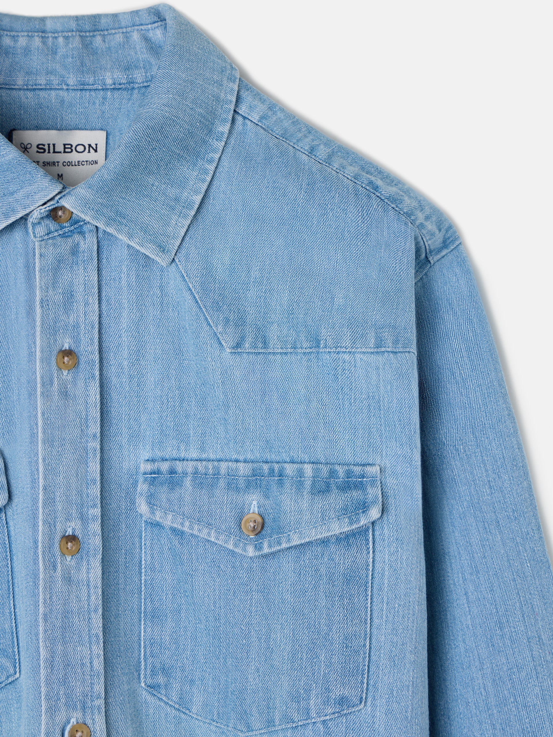 Denim shirt with medium blue pockets