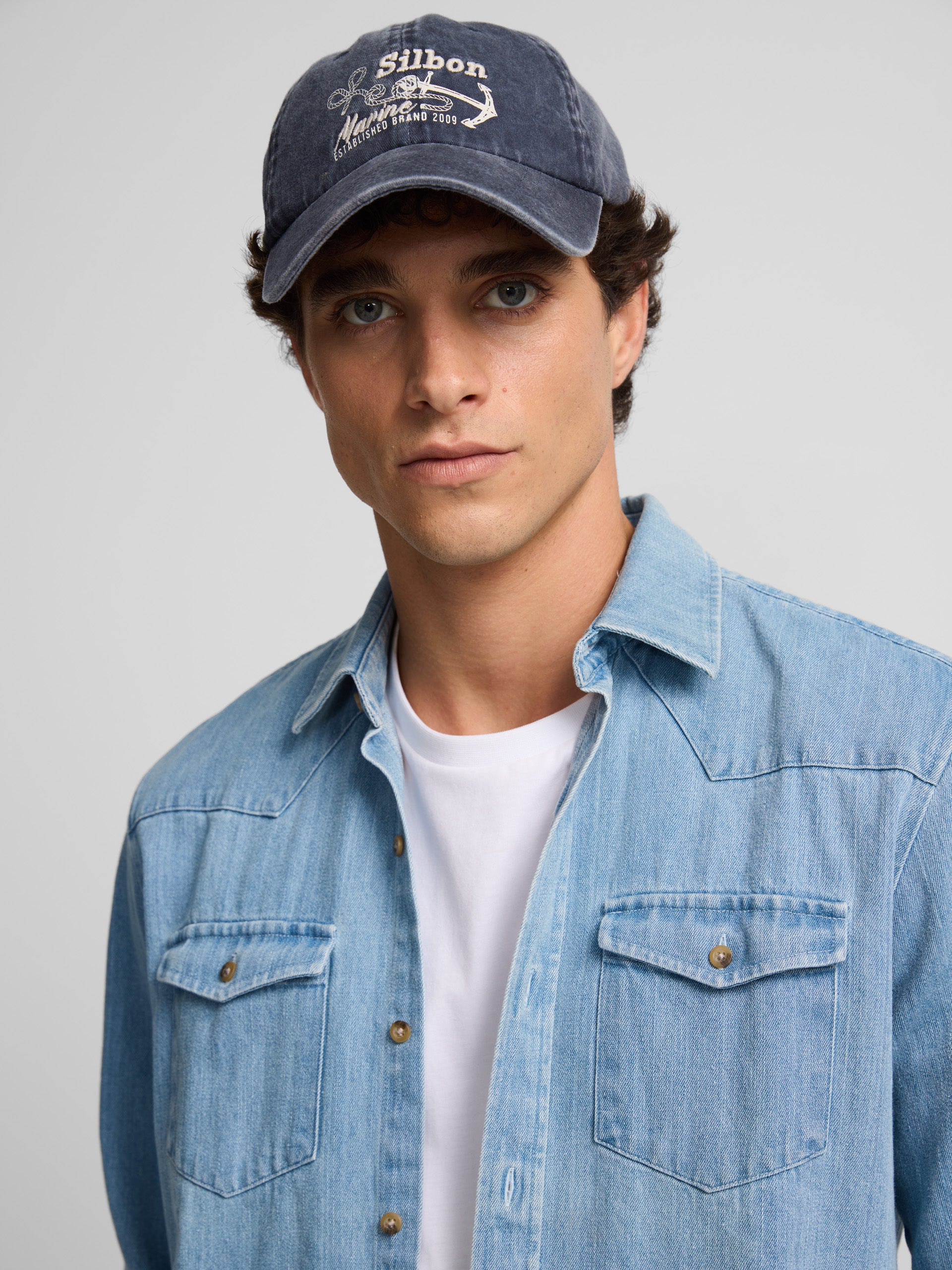 Denim shirt with medium blue pockets