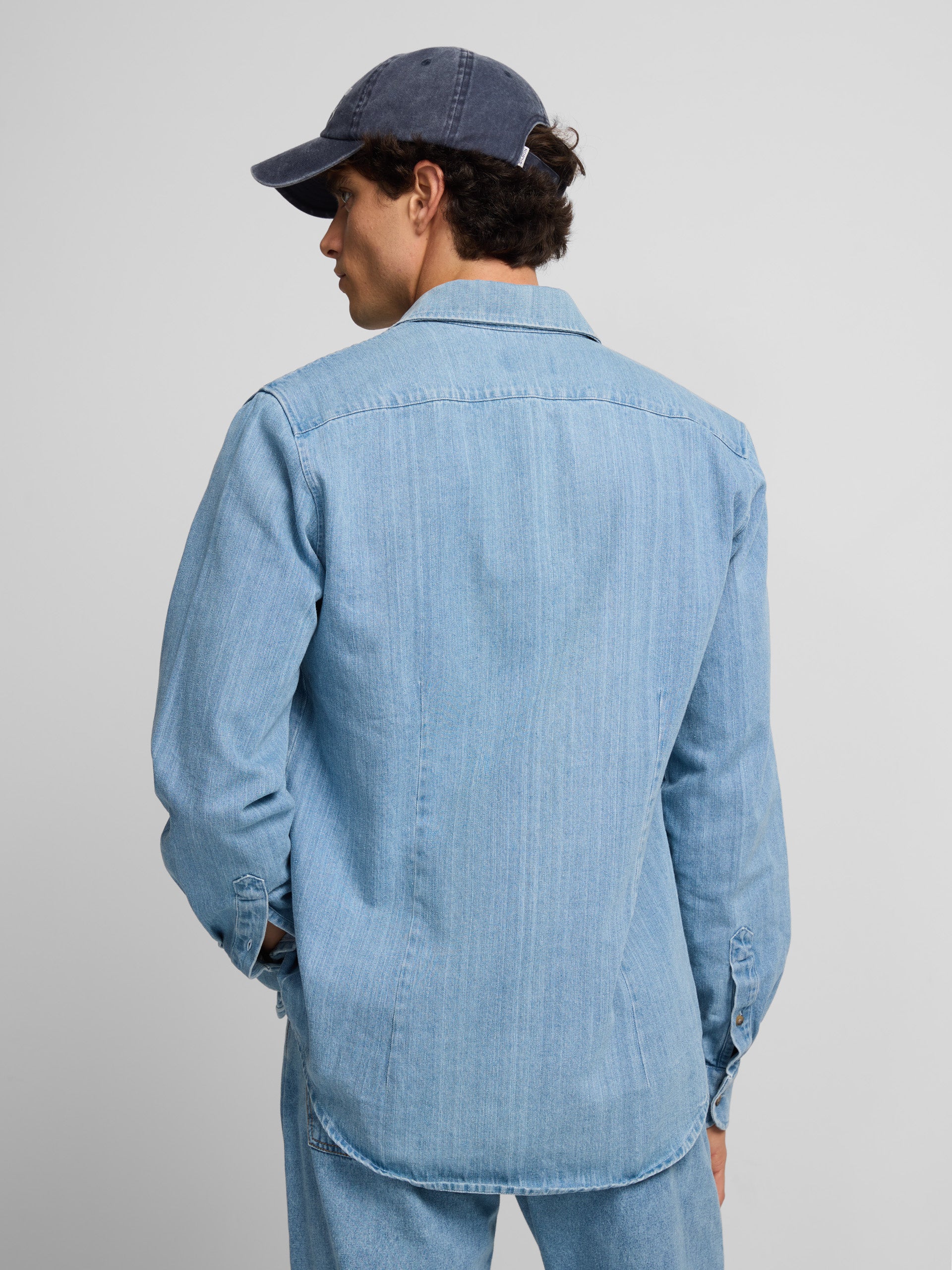 Denim shirt with medium blue pockets