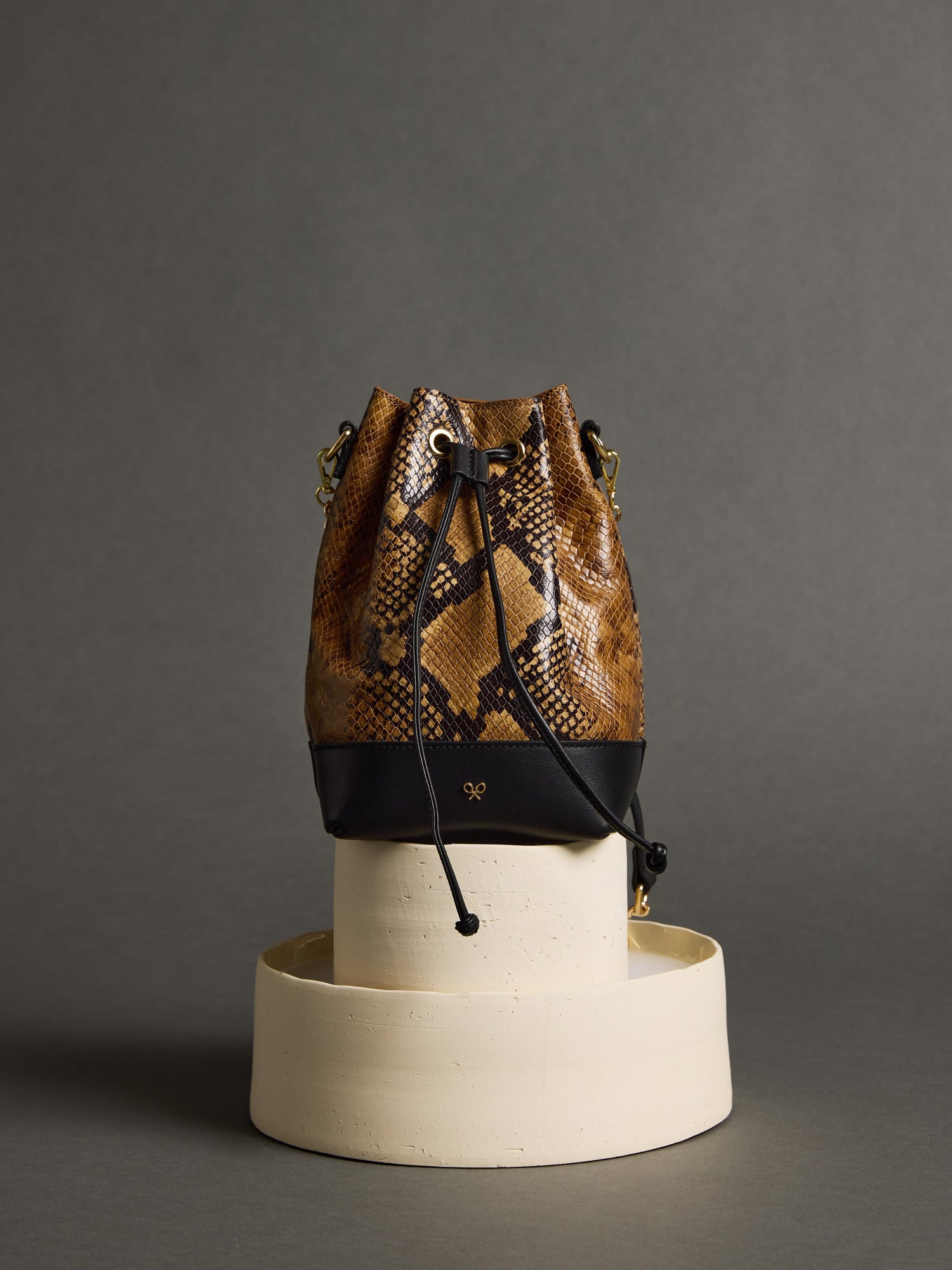 Brown animal print leather sack bag