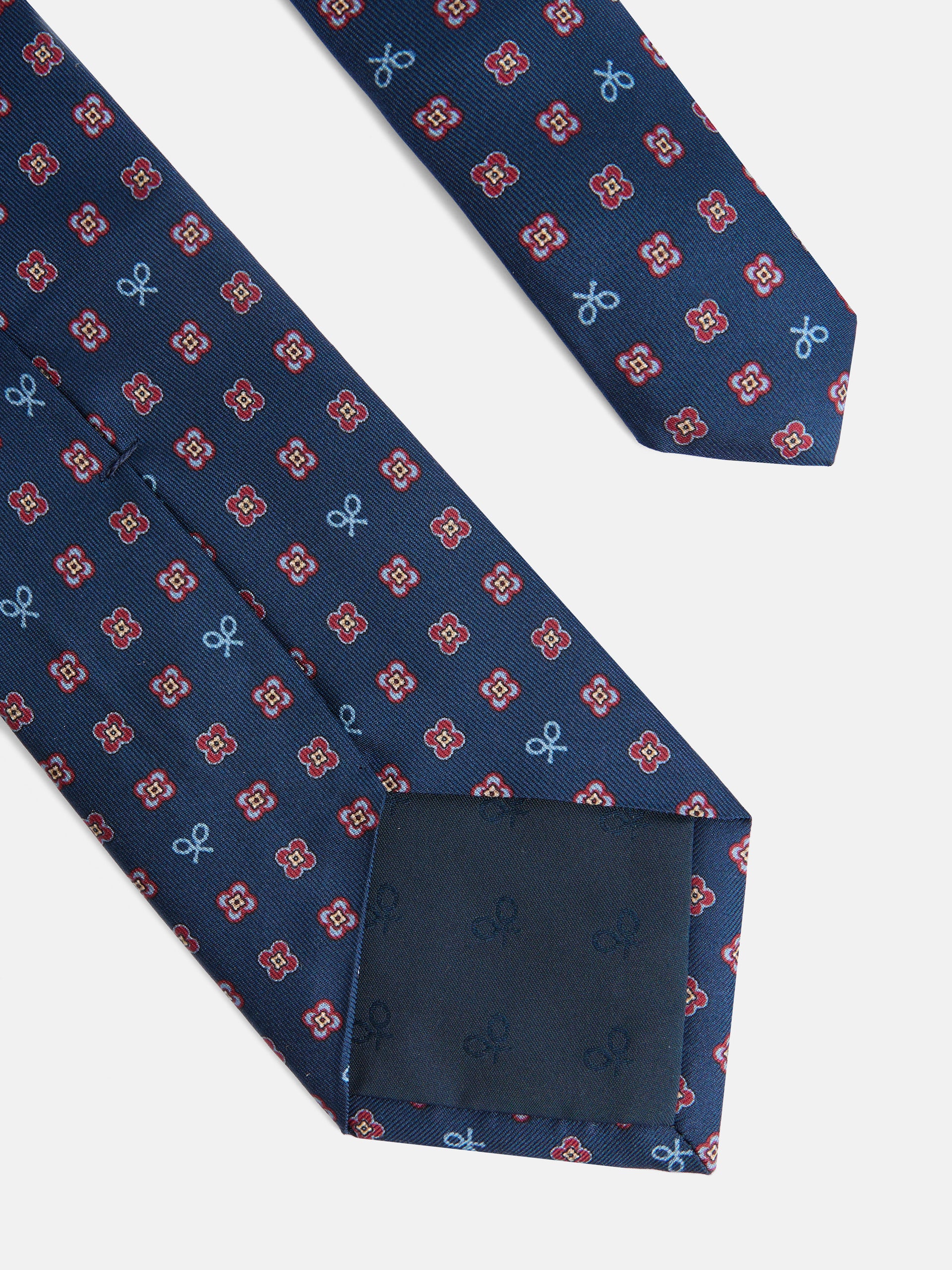 Corbata raquetas motivos geometricos pequeños azul marino