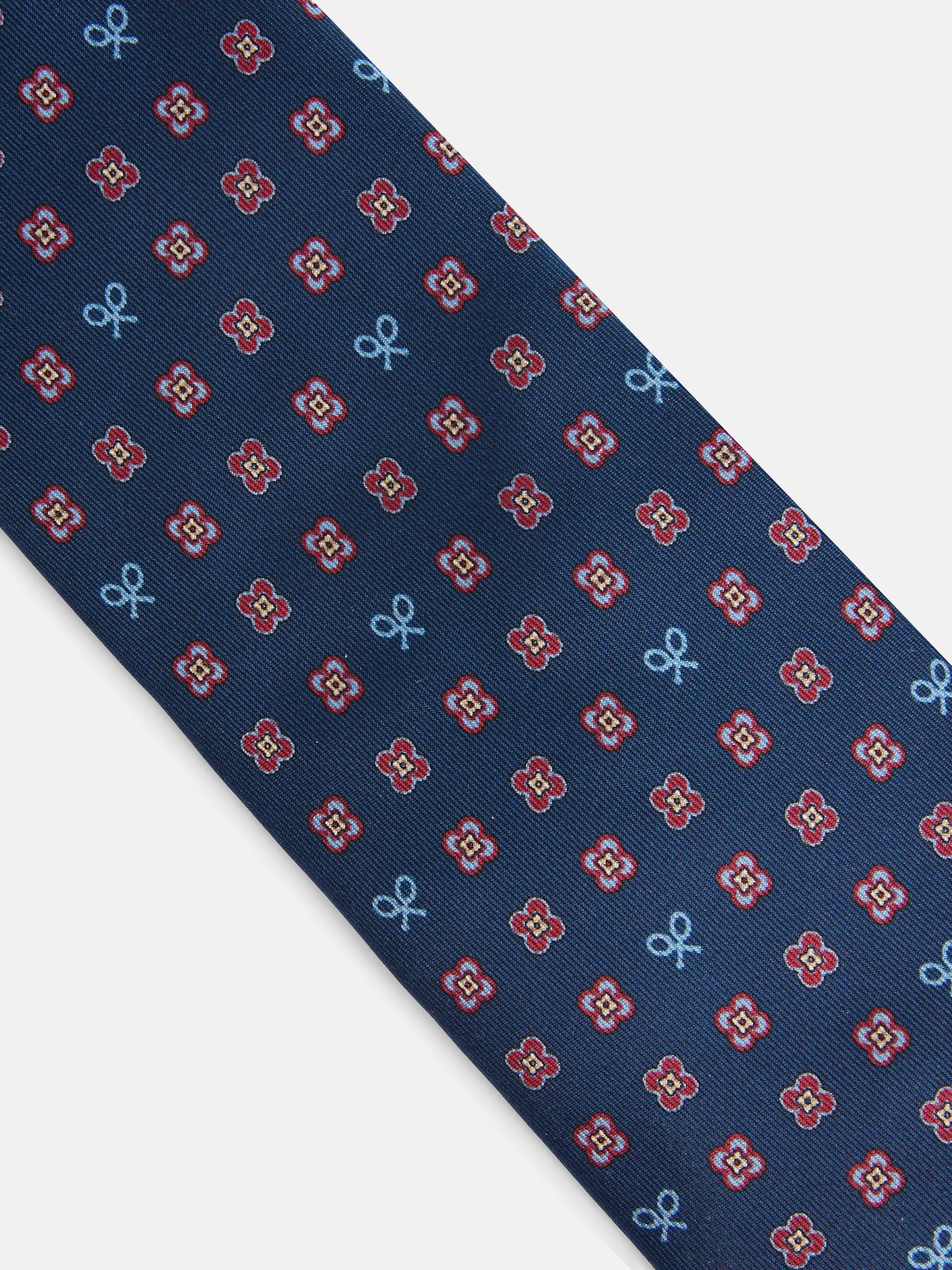 Corbata raquetas motivos geometricos pequeños azul marino