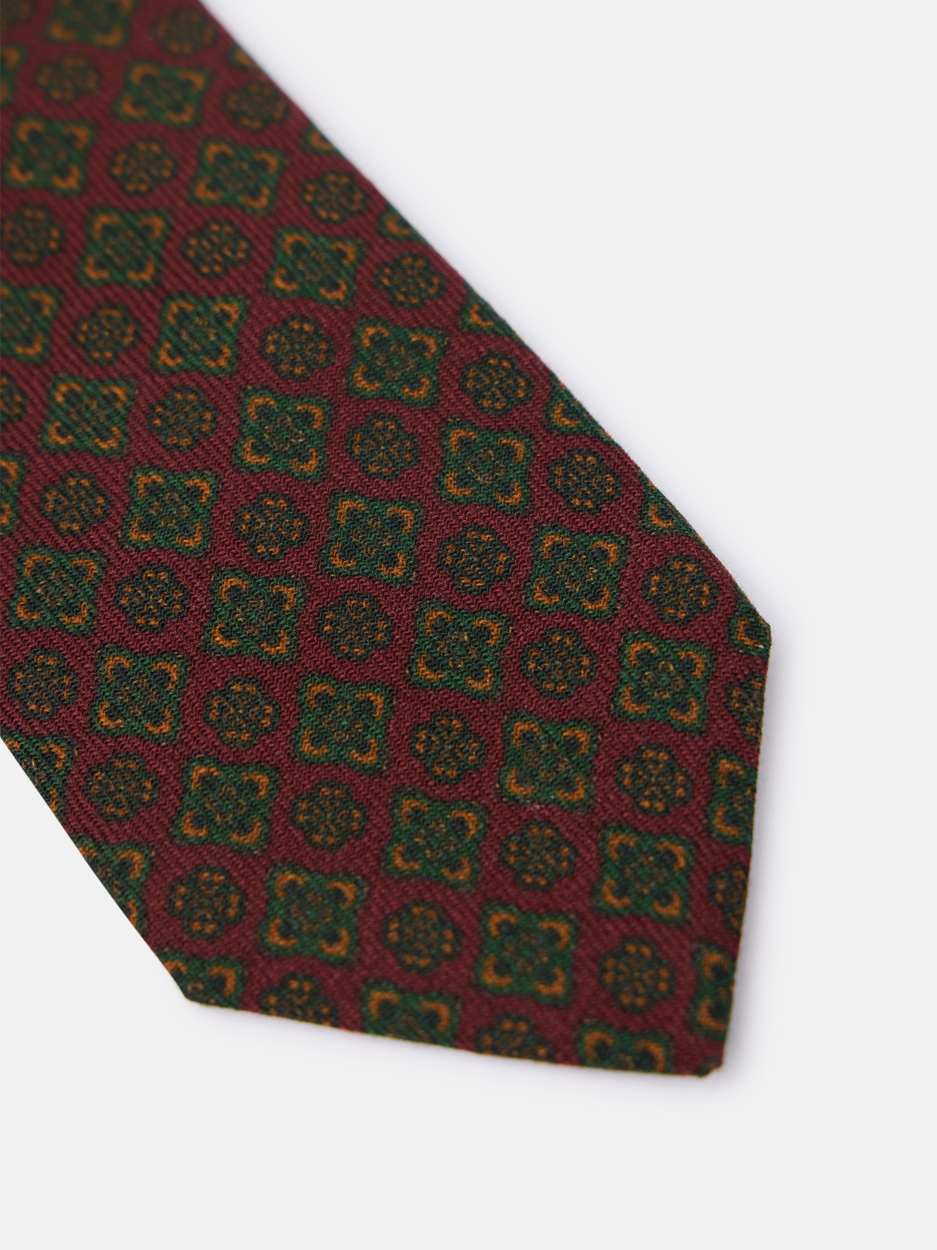 Corbata geometrica floral burdeos